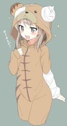 Rule 34 | 10s, 1girl, animal costume, bandages, bear costume, boko (girls und panzer), boko (girls und panzer) (cosplay), brown eyes, brown hair, cosplay, cowboy shot, cropped legs, eyepatch, female focus, girls und panzer, grey background, long hair, mobu, open mouth, pajamas, shimada arisu, simple background, smile, solo, sparkle, standing, translated