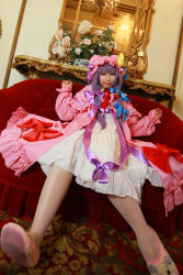 Rule 34 | 1girl, asian, bow, carpet, cosplay, couch, crescent, dress, female focus, flower, hat, long hair, mirror, mob cap, patchouli knowledge, photo (medium), purple hair, red upholstery, ribbon, slippers, solo, tenshi myu, thighhighs, touhou, white dress