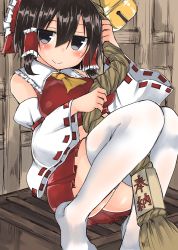 Rule 34 | 1girl, ascot, bell, between legs, black eyes, black hair, blush, bow, breasts, closed mouth, detached sleeves, golgi hon, hair between eyes, hair bow, hair tubes, hakurei reimu, highres, holding, jitome, knees together feet apart, looking at viewer, medium breasts, midriff, miniskirt, no shoes, red bow, rope, short hair, sidelocks, sitting, skirt, smile, solo, thighhighs, touhou, white thighhighs, wide sleeves, zettai ryouiki
