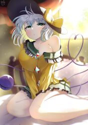 Rule 34 | absurdres, black hat, blurry, blurry background, bow, breasts, commentary request, green eyes, green skirt, grey hair, hat, hat bow, heart, heart of string, highres, indoors, komeiji koishi, large breasts, light particles, long sleeves, looking at viewer, on bed, pillow, polyhedron2, shirt, short hair, signature, single bare shoulder, sitting, skirt, third eye, touhou, v arms, yellow bow, yellow shirt, yokozuwari