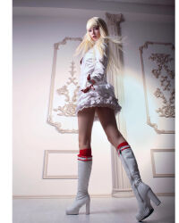 Rule 34 | 1girl, blonde hair, boots, cosplay, emilie de rochefort, emilie de rochefort (cosplay), fingerless gloves, from behind, gloves, highres, long hair, long sleeves, looking at viewer, looking back, nelly laufeyson, photo (medium), real life, skirt, tekken