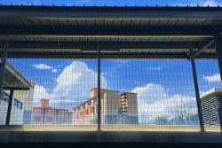 Rule 34 | blue sky, building, cloud, commentary, day, english commentary, fence, highres, making-of available, mclelun, no humans, original, outdoors, scenery, sky, town