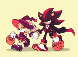 1boy 1girl candy cape closed_eyes closed_mouth cream_the_rabbit food furry furry_female furry_male gloves half-closed_eyes halloween halloween_bucket halloween_costume hat holding holding_hands kiioki11 red_eyes shadow_the_hedgehog shoes simple_background smile sonic_(series) twitter_username walking witch_hat yellow_background