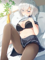 Rule 34 | 10s, 1girl, bed, bed sheet, belly, black bra, black pantyhose, blue eyes, blush, bra, breasts, cleavage, clothes lift, dutch angle, eyebrows, eyes visible through hair, hair ornament, hair over one eye, hairclip, hamakaze (kancolle), igayan, kantai collection, large breasts, looking at viewer, lying, midriff, mouth hold, navel, on back, pantyhose, school uniform, serafuku, shirt, shirt lift, short sleeves, silver hair, solo, underwear