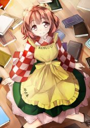 Rule 34 | 1girl, apron, bell, book, checkered clothes, checkered shirt, clothes writing, female focus, hair bell, hair ornament, jingle bell, kazasuzu, long sleeves, motoori kosuzu, red eyes, red hair, shirt, short hair, smile, solo, touhou, twintails, two side up, wide sleeves