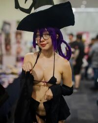Rule 34 | 1girl, bikini, black bikini, blair (soul eater), blair (soul eater) (cosplay), blurry, blurry background, breasts, cosplay, female focus, glasses, hat, large breasts, looking at viewer, mexican (nationality), micro bikini, mole, mole on breast, oz cosplay, photo (medium), purple hair, solo, soul eater, swimsuit, witch hat, yellow eyes