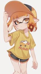 Rule 34 | 1girl, baseball cap, black shorts, closed mouth, commentary request, hat, highres, inkling, inkling girl, inkling player character, nintendo, orange eyes, orange hair, orange hat, pointy ears, print shirt, shirt, short hair, shorts, simple background, solo, splatoon (series), white background, yellow shirt, yn uo0