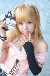 Rule 34 | 1girl, amane misa, amane misa (cosplay), asian, bare shoulders, blonde hair, breasts, color contacts, cosplay, cross, death note, dutch angle, fingerless gloves, gloves, hair ornament, highres, indoors, jewelry, kipi-san, long hair, looking at viewer, mole, photo (medium), ring, single glove, skull and crossbones, skull hair ornament, skull ring, small breasts, solo, two side up