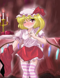 1girl blonde_hair blush candle candlestand collared_shirt female_focus flandre_scarlet flx hat mob_cap one_eye_closed one_side_up ponytail red_eyes shirt side_ponytail solo striped_clothes striped_thighhighs thighhighs touhou undressing vampire white_hat wings wink