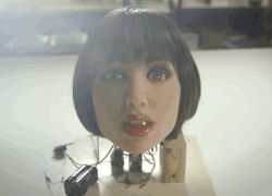 Rule 34 | 1girl, animated, animated gif, doll, lipstick, looking at viewer, lowres, makeup, open mouth, photo (medium), robot, short hair, tongue