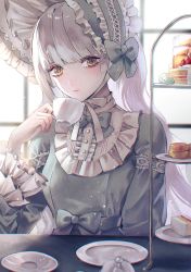 Rule 34 | 1girl, blunt bangs, bonnet, bow, cake, cake slice, call bell, cup, dessert, dress, food, frills, highres, holding, holding cup, indoors, lolita fashion, long hair, macaron, original, plate, sakuyu, saucer, sitting, solo, strawberry shortcake, table, teacup, tiered tray, waist bow, white hair, window, yellow eyes