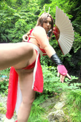 Rule 34 | breasts, brown eyes, brown hair, censored, chouzuki maryou, cosplay, hair ornament, hand fan, large breasts, long hair, photo (medium), plump, ponytail, shiranui mai, shiranui mai (cosplay), snk, the king of fighters, thick thighs, thighs, very long hair, wardrobe malfunction