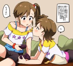 Rule 34 | 2girls, black shorts, blush, brown eyes, brown hair, chips (food), controller, food, futami ami, futami mami, game controller, highres, holding, holding controller, holding game controller, idolmaster, idolmaster (classic), looking at another, mizin kosutin, mouth hold, multiple girls, red scrunchie, scrunchie, short hair, short sleeves, shorts, siblings, side ponytail, sisters, speech bubble, translation request, wrist scrunchie
