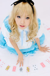 Rule 34 | 1girl, alice (alice in wonderland), alice (alice in wonderland) (cosplay), alice in wonderland, apron, asian, blonde hair, blue eyes, breasts, card, color contacts, cosplay, hair ribbon, kipi-san, long hair, looking at viewer, mole, petite, photo (medium), playing card, ribbon, simple background, small breasts, solo, white background