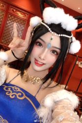 Rule 34 | absurdres, animal ears, blue dress, blush, bracelet, brown eyes, cat ears, chinese text, detached sleeves, dress, fur trim, gesture, highres, indoors, jewelry, jianyan (name), lips, necklace, necklace on head, pearl necklace, photo (medium), real life, red walls, smile, teeth, tongue, tongue out, weibo logo, weibo watermark