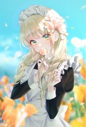 Rule 34 | 1girl, apron, black dress, blonde hair, blue sky, blurry, blurry background, blush, buri (retty9349), closed mouth, dress, flower, green eyes, hair flower, hair ornament, head tilt, highres, holding, holding flower, long hair, long sleeves, looking at viewer, maid, maid apron, maid headdress, original, outdoors, plant, sky, smile, solo, standing