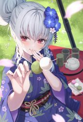 Rule 34 | 1girl, blue archive, blue flower, blurry, blush, braid, commentary request, cup, dango, day, depth of field, eating, falling petals, floral print kimono, flower, food, food in mouth, grass, grey halo, hair bun, hair flower, hair ornament, halo, haruna (blue archive), haruna (new year) (blue archive), highres, holding, holding food, japanese clothes, kimono, long sleeves, looking at viewer, obi, obijime, official alternate costume, official alternate hairstyle, outdoors, petals, primamiya, purple kimono, red eyes, sash, single braid, single hair bun, solo, teapot, wagashi, wide sleeves