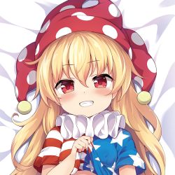 Rule 34 | 1girl, american flag shirt, baku-p, bed, blonde hair, blue shirt, blush, breasts, closed mouth, clownpiece, dakimakura (medium), fang, hair between eyes, hand up, hat, jester cap, long hair, looking at viewer, looking up, lying, multicolored clothes, multicolored shirt, polka dot, red eyes, red hat, red shirt, shirt, short sleeves, small breasts, smile, solo, star (symbol), star print, striped clothes, striped shirt, teeth, touhou, upper body, white shirt