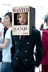 Rule 34 | ace attorney, blonde hair, capcom, character name, cosplay, formal, hands in pockets, looking at viewer, male focus, miles edgeworth, one piece, photo (medium), sanji (one piece), sanji (one piece) (cosplay), suit, wanted, wanted poster